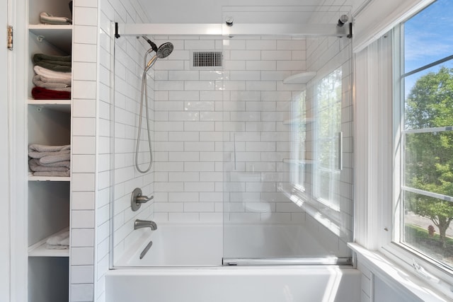 770 Bloomfield Blvd, Jackson, MI 49203 - bathroom with bathing tub / shower combination and healthy amount of natural light