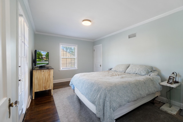 770 Bloomfield Blvd, Jackson, MI 49203 - bedroom with dark wood finished floors, ornamental molding, and baseboards