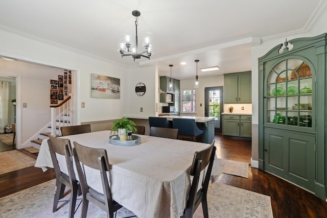 770 Bloomfield Blvd, Jackson, MI 49203 - dining room with stairs, dark wood-style flooring, a chandelier, and ornamental molding