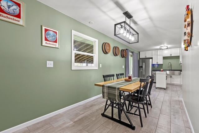 507 E 4th St, Hersey, MI 49639 - dining space with light wood-type flooring and baseboards