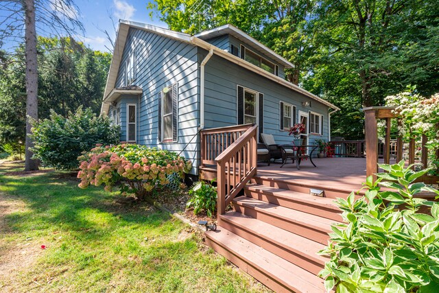 8661 Elm Valley Rd, Union Pier, MI 49129 - wooden terrace featuring a yard