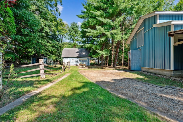 8661 Elm Valley Rd, Union Pier, MI 49129 - view of yard with an outdoor structure and driveway