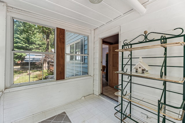 8661 Elm Valley Rd, Union Pier, MI 49129 - unfurnished sunroom featuring beam ceiling