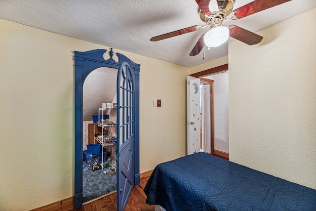 8661 Elm Valley Rd, Union Pier, MI 49129 - bedroom with wood finished floors, ceiling fan, a textured ceiling, and baseboards