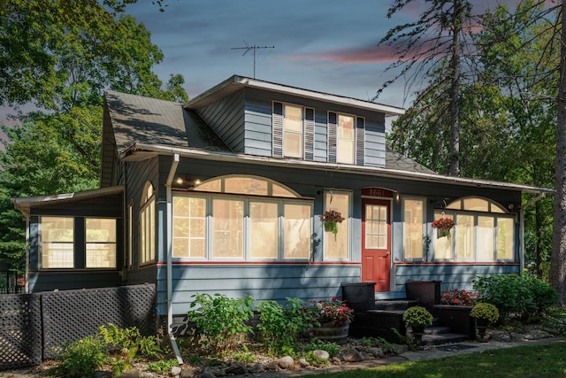 8661 Elm Valley Rd, Union Pier, MI 49129 - view of front of property with a sunroom