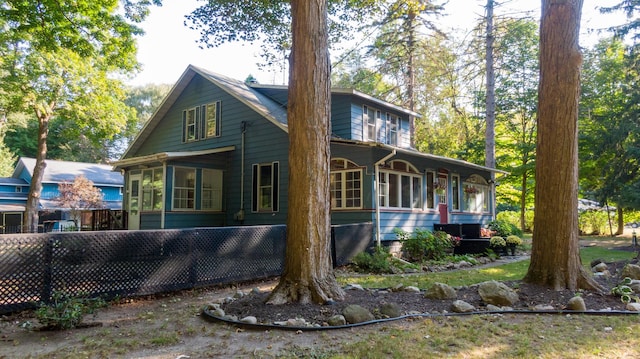 8661 Elm Valley Rd, Union Pier, MI 49129 - view of front of home featuring a sunroom