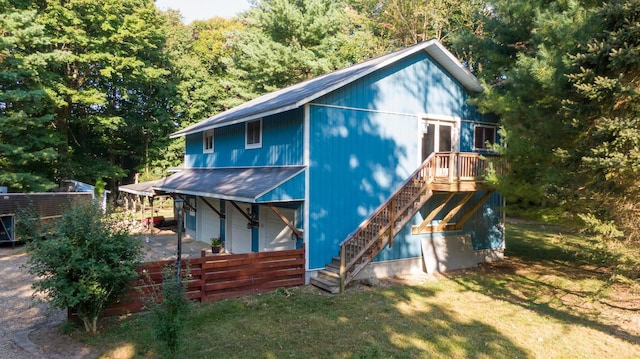 8661 Elm Valley Rd, Union Pier, MI 49129 - view of front of property with a garage and stairway
