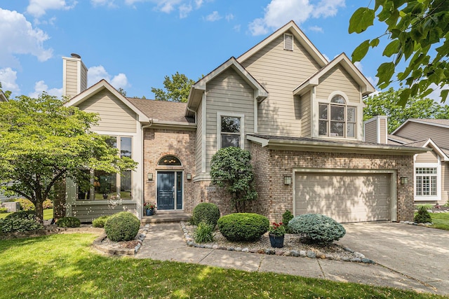 4223 Spring Lake Blvd, Ann Arbor, MI 48108 - view of front of home featuring brick siding, concrete driveway, an attached garage, and a front lawn