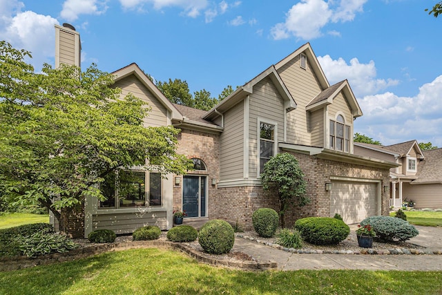 4223 Spring Lake Blvd, Ann Arbor, MI 48108 - view of front of property with brick siding, a chimney, an attached garage, and a front yard