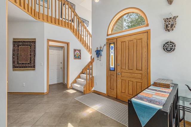 4223 Spring Lake Blvd, Ann Arbor, MI 48108 - entryway featuring stairs, baseboards, and a towering ceiling