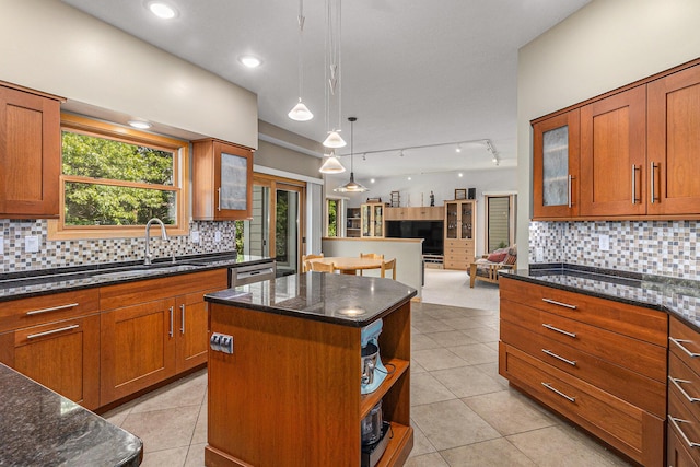4223 Spring Lake Blvd, Ann Arbor, MI 48108 - kitchen featuring a center island, open floor plan, brown cabinetry, backsplash, and recessed lighting