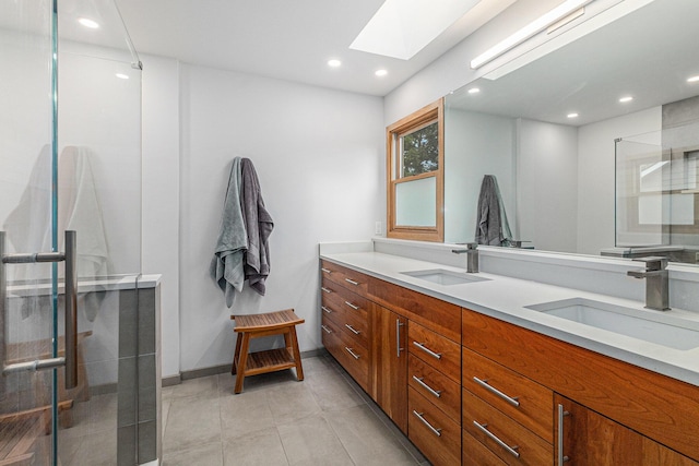 4223 Spring Lake Blvd, Ann Arbor, MI 48108 - bathroom with a skylight, double vanity, recessed lighting, a stall shower, and baseboards