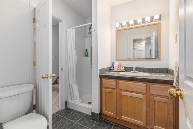 4223 Spring Lake Blvd, Ann Arbor, MI 48108 - bathroom featuring a shower stall, vanity, tile patterned flooring, and toilet