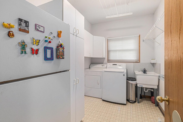 4223 Spring Lake Blvd, Ann Arbor, MI 48108 - laundry room featuring cabinet space, independent washer and dryer, and light floors
