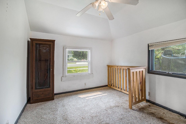 302 Wood St, Hart, MI 49420 - unfurnished room with lofted ceiling, carpet floors, a ceiling fan, and baseboards