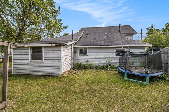 302 Wood St, Hart, MI 49420 - rear view of property featuring a trampoline