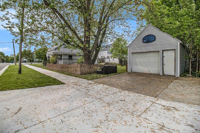 302 Wood St, Hart, MI 49420 - detached garage featuring concrete driveway