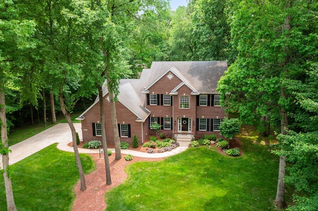 33081 Old Post Rd, Niles, MI 49120 - colonial house featuring brick siding, a front lawn, and concrete driveway