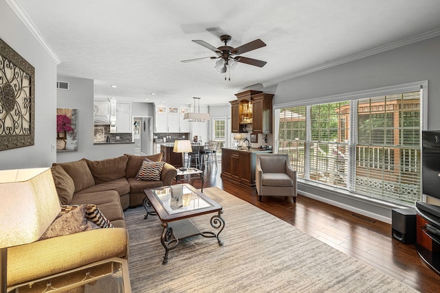 33081 Old Post Rd, Niles, MI 49120 - living area featuring a ceiling fan, dark wood finished floors, and crown molding