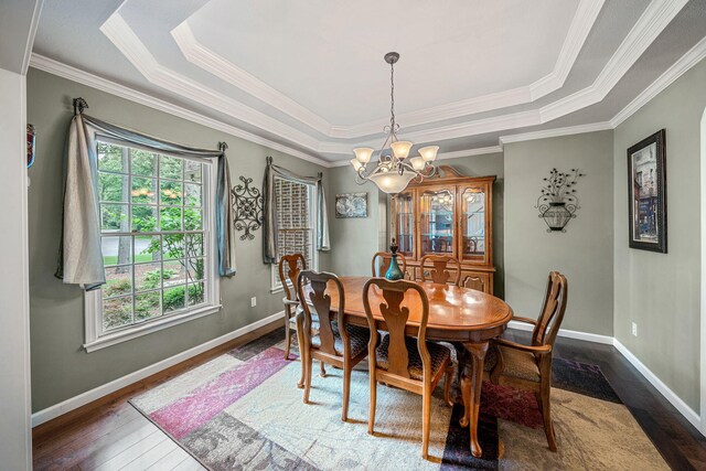 33081 Old Post Rd, Niles, MI 49120 - dining room featuring a chandelier, dark wood-style floors, a tray ceiling, crown molding, and baseboards