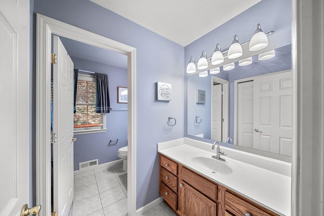 33081 Old Post Rd, Niles, MI 49120 - bathroom with toilet, vanity, baseboards, and tile patterned flooring