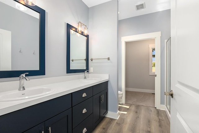 0 Shagawa Trl, Lowell, MI 49331 - full bath featuring double vanity, wood finished floors, toilet, a stall shower, and baseboards
