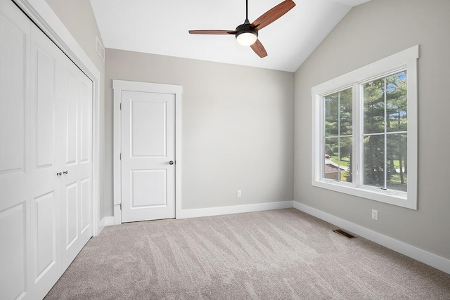 0 Shagawa Trl, Lowell, MI 49331 - unfurnished bedroom with lofted ceiling, carpet flooring, a closet, baseboards, and a ceiling fan