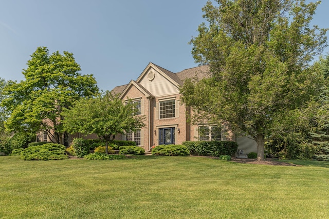 6240 Vineyard Ave, Ann Arbor, MI 48108 - view of front of home featuring a front lawn and brick siding