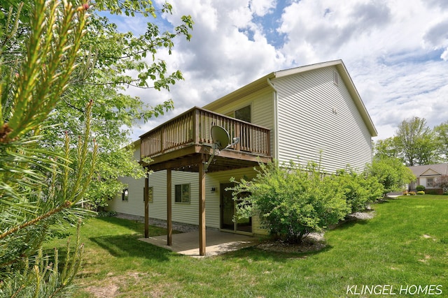 926 N Sandalwood Cir, Muskegon, MI 49441 - rear view of property with a patio area, a yard, and a wooden deck