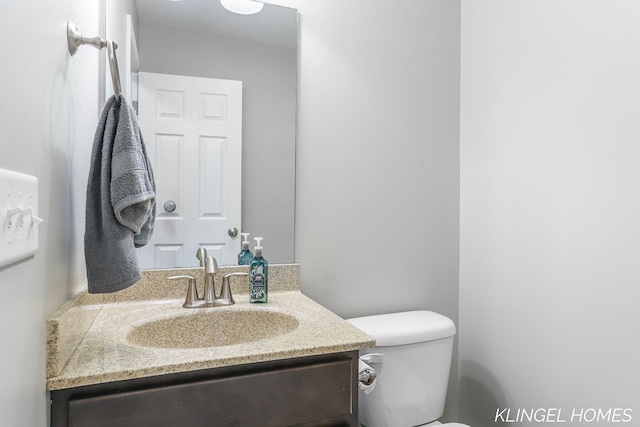 926 N Sandalwood Cir, Muskegon, MI 49441 - bathroom with vanity and toilet