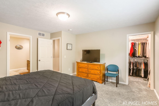 926 N Sandalwood Cir, Muskegon, MI 49441 - carpeted bedroom featuring a spacious closet, a closet, and baseboards