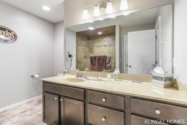926 N Sandalwood Cir, Muskegon, MI 49441 - full bath featuring vanity, a tile shower, baseboards, and tile patterned floors