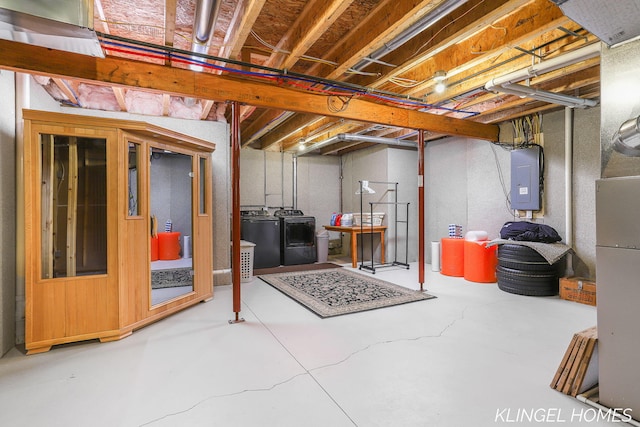 926 N Sandalwood Cir, Muskegon, MI 49441 - unfinished basement featuring washing machine and clothes dryer and electric panel