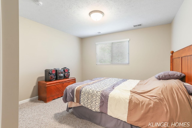 926 N Sandalwood Cir, Muskegon, MI 49441 - carpeted bedroom with a textured ceiling and baseboards