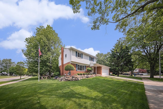 489 Old Creek Ct, Saline, MI 48176 - traditional-style house with brick siding, an attached garage, a front yard, and a chimney