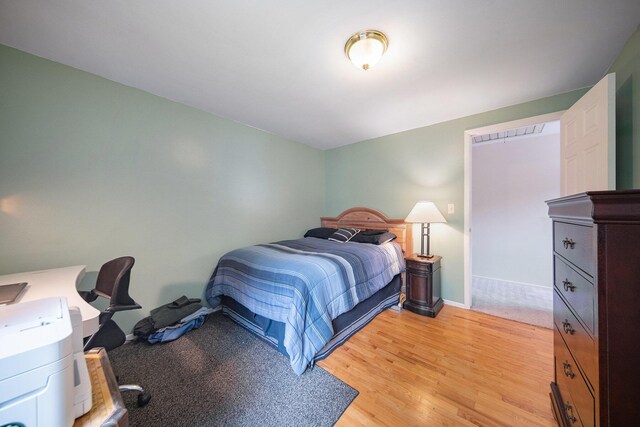 489 Old Creek Ct, Saline, MI 48176 - bedroom featuring light wood-style floors and baseboards