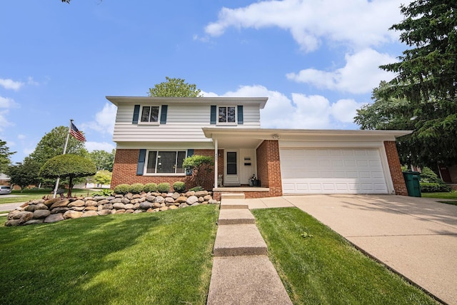 489 Old Creek Ct, Saline, MI 48176 - traditional-style house with brick siding, a garage, concrete driveway, and a front yard