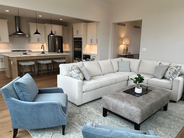 4846 W Burton Ln Unit 22, Saline, MI 48176 - living room with light wood-type flooring and recessed lighting