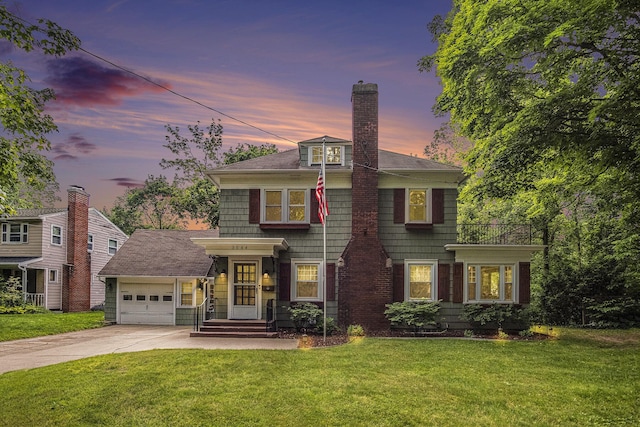 3544 Briggs Blvd NE, Grand Rapids, MI 49525 - view of front facade with driveway, a chimney, a yard, and an attached garage