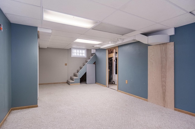 3544 Briggs Blvd NE, Grand Rapids, MI 49525 - below grade area featuring a drop ceiling, carpet floors, stairway, and baseboards