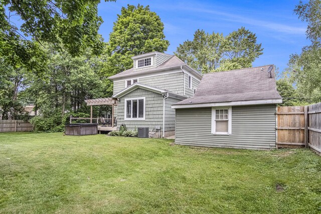 3544 Briggs Blvd NE, Grand Rapids, MI 49525 - rear view of property featuring a hot tub, a pergola, and cooling unit