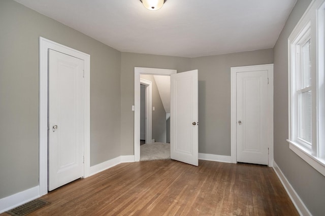 3544 Briggs Blvd NE, Grand Rapids, MI 49525 - unfurnished bedroom featuring wood finished floors and baseboards
