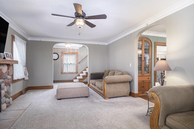 3544 Briggs Blvd NE, Grand Rapids, MI 49525 - living room with arched walkways, carpet, crown molding, and baseboards