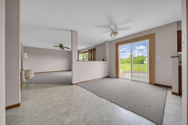 2045 E Baldwin Rd, Grand Blanc, MI 48439 - unfurnished living room featuring ceiling fan, baseboards, and carpet flooring