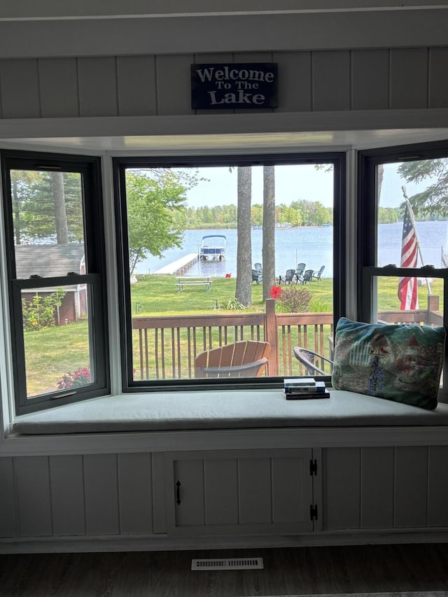 1142 Wolf Lake Dr, Baldwin, MI 49304 - sunroom / solarium with a water view and plenty of natural light