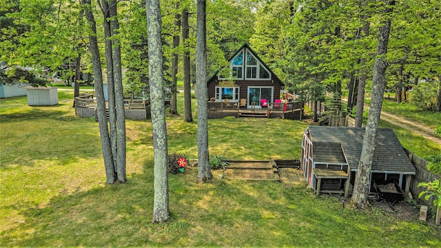 1142 Wolf Lake Dr, Baldwin, MI 49304 - view of grassy yard featuring a wooden deck