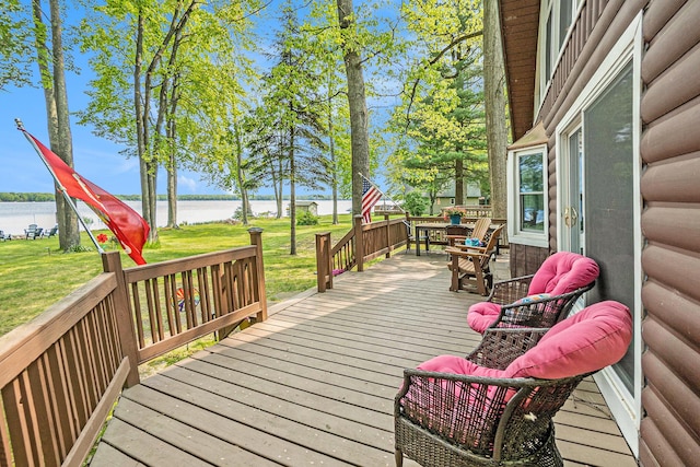 1142 Wolf Lake Dr, Baldwin, MI 49304 - wooden deck featuring a water view and a yard