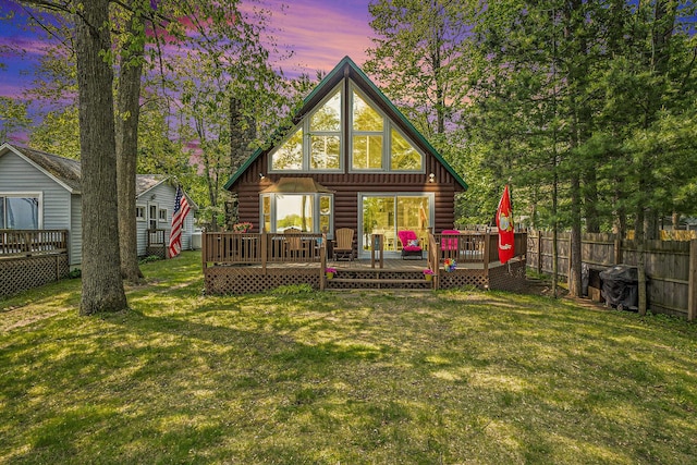 1142 Wolf Lake Dr, Baldwin, MI 49304 - back of property featuring a deck and a chimney
