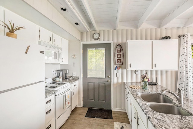 1142 Wolf Lake Dr, Baldwin, MI 49304 - kitchen featuring white appliances, a sink, light wood-style floors, beam ceiling, and white cabinetry