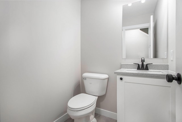 2141 N 35th St, Galesburg, MI 49053 - bathroom with toilet, baseboards, and vanity
